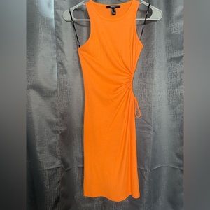 Bring orange dress with open side. perfect for brunch in the summer 🧡